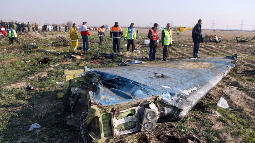 Rescue teams are seen on January 8, 2020 at the scene of a Ukrainian airliner that crashed shortly after take-off near Imam Khomeini airport in the Iranian capital Tehran. - Search-and-rescue teams were combing through the smoking wreckage of the Boeing 737 flight from Tehran to Kiev but officials said there was no hope of finding anyone alive. The vast majority of the passengers on the Ukraine International Airlines flight were non-Ukrainians, including 82 Iranians and 63 Canadians, officials said. (Photo 