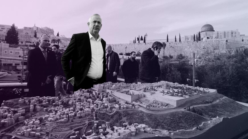Benny Gantz, leader of Blue and White party, stands behind a model of Jerusalem's Old City and surrounding areas as he tours "The City of David", a Jewish heritage site in Silwan, East Jerusalem January 14, 2020. REUTERS/Ammar Awad - RC2QFE9ITSWC