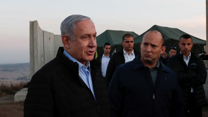 Israeli Prime Minister Benjamin Netanyahu and his Defense Minister Naftali Bennett visit an Israeli army base in the Israeli-occupied Golan Heights, November 24, 2019. Atef Safadi/Pool via REUTERS - RC2THD9OHSNJ