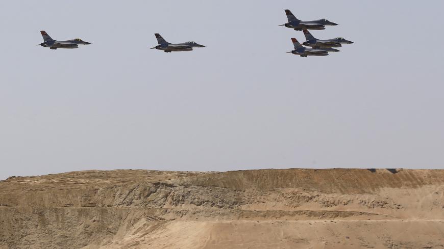 Egyptian air force planes parade during the inauguration ceremony of the new Suez Canal, in Ismailia, Egypt, August 6, 2015. Egypt staged a show of international support on Thursday as it inaugurated a major extension of the Suez Canal which President Abdel Fattah al-Sisi hopes will power an economic turnaround in the Arab world's most populous country. REUTERS/Amr Abdallah Dalsh - GF20000015690