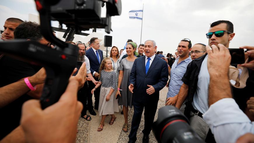 Members of the media work as Israeli Prime Minister Benjamin Netanyahu walks after holding a weekly cabinet meeting in the Jordan Valley, in the Israeli-occupied West Bank September 15, 2019. REUTERS/Amir Cohen - RC1DC97D0610