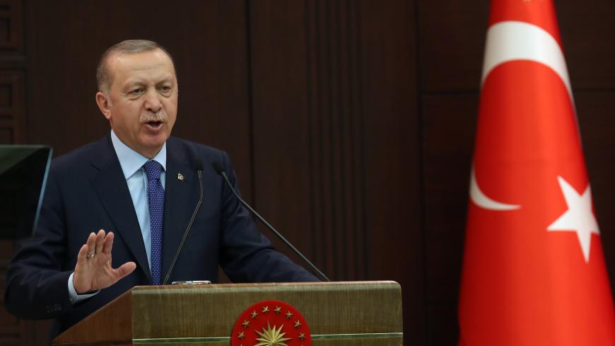 Turkish President Recep Tayyip Erdogan speaks during a press conference held after the coordination meeting to fight against the novel coronavirus, COVID-19, at the Cankaya Palace in Ankara on March 18, 2020. - President Recep Tayyip Erdogan announced on March 18, 2020, a $15 billion package to help the Turkish economy cope with the crisis over the new coronavirus, and urged Turks to leave their homes as little as possible. Turkey has so far recorded one death and 98 cases. (Photo by Adem ALTAN / AFP) (Phot