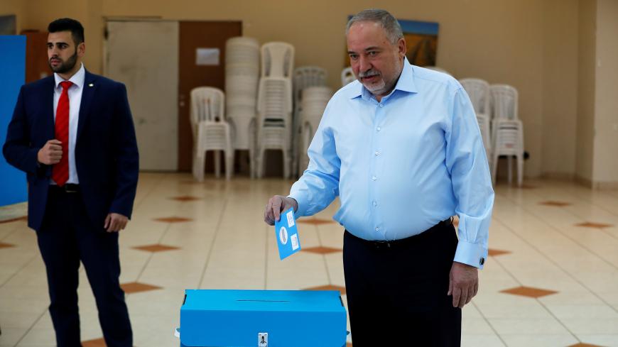Avigdor Lieberman, leader of the ultranationalist Yisrael Beitenu party, prepares to cast his ballot as he votes in Israel's national election at a polling station in the Israeli settlement of Nokdim in the occupied West Bank March 2, 2020. REUTERS/Ronen Zvulun - RC2IBF9YO4XV