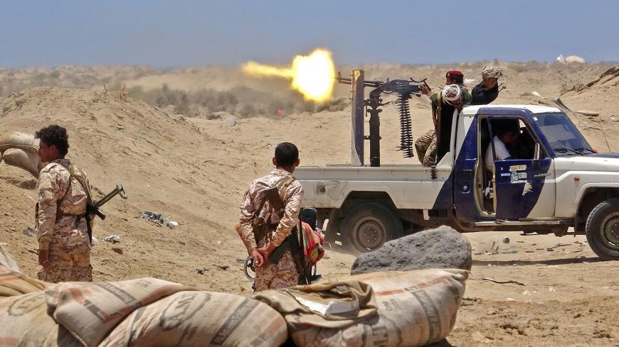 TOPSHOT - Fighters from of the Southern Transitional Council (STC) fire towards the positions of Saudi-backed government forces during clashes in the Sheikh Salim area in the southern Abyan province on May 11, 2020. (Photo by Nabil HASAN / AFP) (Photo by NABIL HASAN/AFP via Getty Images)