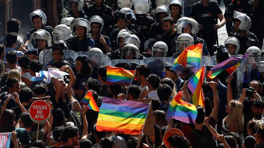Riot police prevent LGBT rights activists from marching for a pride parade, which was banned by the governorship, in central Istanbul, Turkey, June 30, 2019. REUTERS/Murad Sezer - RC177BE85A00