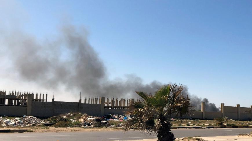 Smoke rises from Mitiga Airport after being attacked in Tripoli, Libya February 28, 2020. REUTERS/Ahmed Elumami - RC2O9F9S4FIK