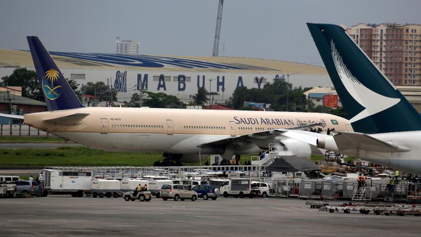 A Saudi Arabian Airlines passenger plane is pictured parked at the tarmac of Ninoy Aquino International airport in Pasay city, Metro Manila, Philippines September 20, 2016.    REUTERS/Erik De Castro - S1BEUCJDTUAB