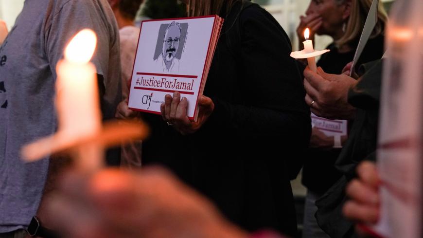 The Committee to Protect Journalists and other press freedom activists hold a candlelight vigil in front of the Saudi Embassy to mark the anniversary of the killing of journalist Jamal Khashoggi at the kingdom's consulate in Istanbul, Wednesday evening in Washington, U.S., October 2, 2019. REUTERS/Sarah Silbiger - RC1156AFC4B0