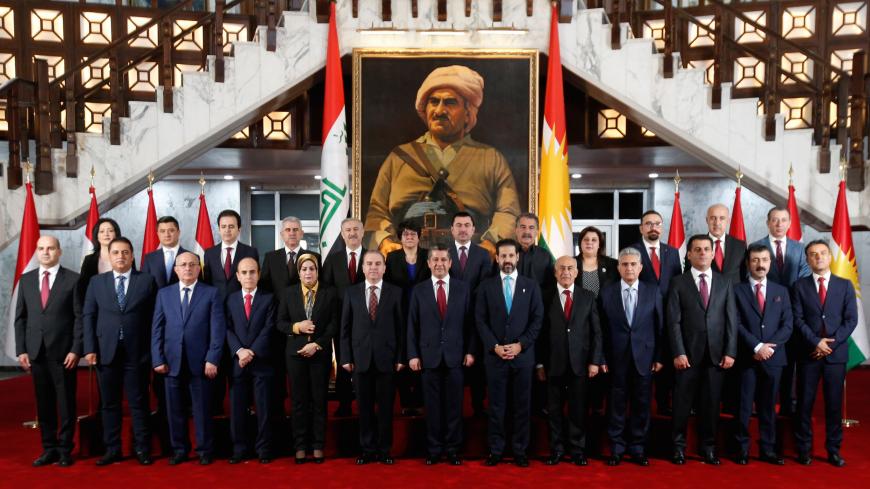 Members of the new cabinet of the Kurdistan parliament headed by Prime Minister Masrour Barzani pose for a family photo, in Erbil, Iraq July 10, 2019. REUTERS/Azad Lashkari - RC1B64599A60