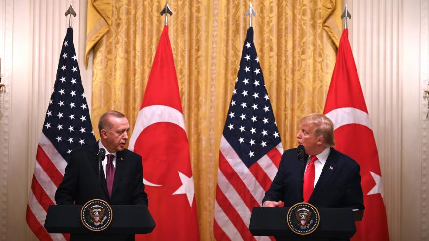 US President Donald Trump and Turkey's President Recep Tayyip Erdogan (L) take part in a joint press conference in the East Room of the White House in Washington, DC on November 13, 2019. - President Donald Trump greeted his Turkish counterpart Recep Tayyip Erdogan at the White House for a high-stakes meeting Wednesday that underlined his claim to be ignoring the impeachment drama unfolding simultaneously in Congress. (Photo by JIM WATSON / AFP) (Photo by JIM WATSON/AFP via Getty Images)