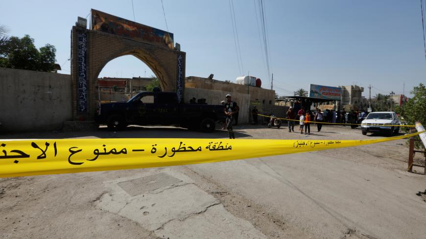 Police tape cordon is seen at the site of a bomb attack at a Shi'ite Muslim mosque in the Baladiyat neighbourhood of Baghdad, Iraq June 21, 2019. REUTERS/Khalid Al-Mousily - RC1F71BFBE30