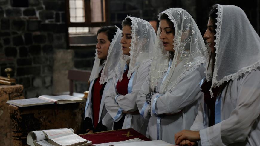 Syriac Christian girls, who are members of the choir, attend a mass on Christmas at the Virgin Mary Syriac Orthodox Church in Diyarbakir, Turkey, December 25, 2017. REUTERS/Sertac Kayar - RC1E35E59DE0