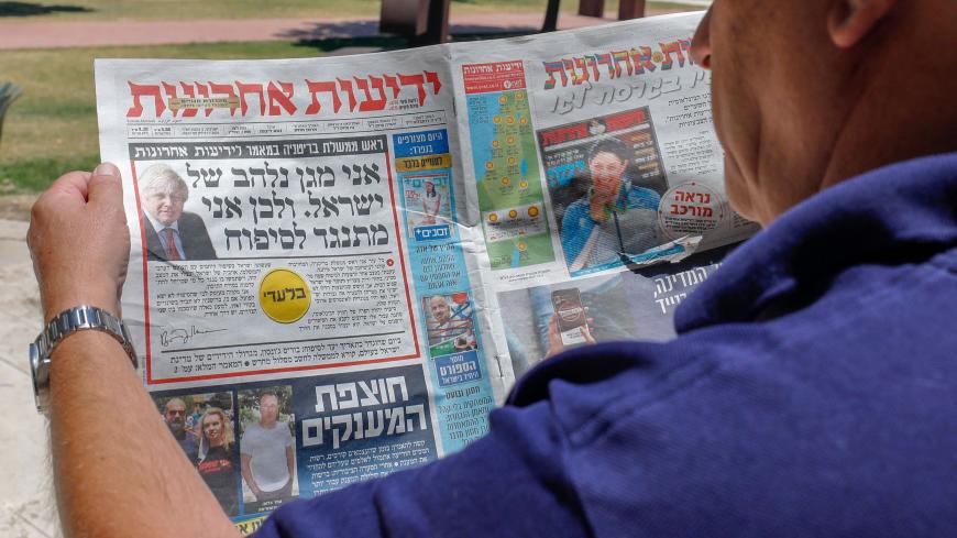 The front page of Israel's daily Yedioth Ahronoth, the country's leading daily newspaper, shows a headline from an interview by British Prime Minister Boris Johnson reading in Hebrew: "I am passionate defender of Israel that's why I oppose the annexation", in Jerusalem on July 1, 2020. - The government of Israeli Prime Minister Benjamin Netanyahu has said it could begin the process to annex Jewish settlements in the West Bank as well as the strategic Jordan Valley from today. The plan -- endorsed by Washing