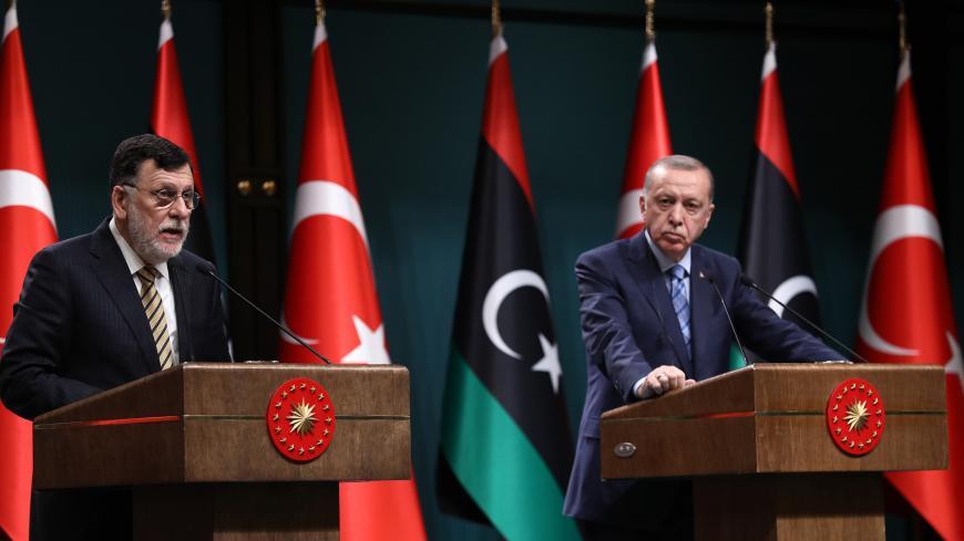 Turkish President Recep Tayyip Erdogan (R) and Libyan Prime Minister Fayez al-Sarraj (L) hold a joint press conference at the Presidential Complex in Ankara on June 4, 2020. (Photo by Adem ALTAN / AFP) (Photo by ADEM ALTAN/AFP via Getty Images)