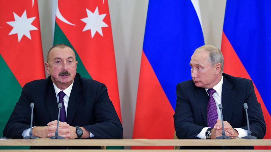 Azeri President Ilham Aliyev (L) talks during his meeting with Russian President Vladimir Putin in Sochi on September 1, 2018. (Photo by Alexey DRUZHININ / Sputnik / AFP)        (Photo credit should read ALEXEY DRUZHININ/AFP via Getty Images)