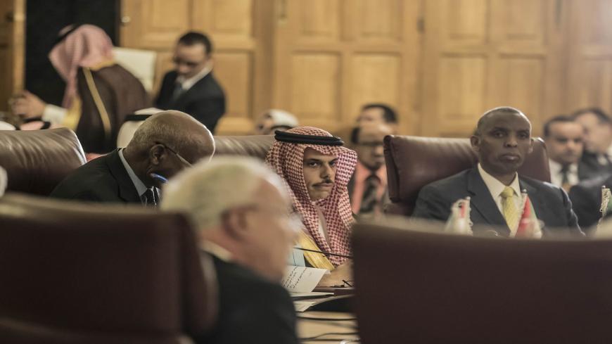Saudi Foreign Minister Faisal Bin Farhan (C) attends an emergency meeting at the Arab League headquarters in the Egyptian capital Cairo, on November 25, 2019, to discuss the US decision to no longer consider Israeli settlements in Palestinian Territories illegal. - US Secretary of State Mike Pompeo said on October 18 that after legal consultations, that Washington had concluded the establishment of settlements was "not, per se, inconsistent with international law". (Photo by Khaled DESOUKI / AFP) (Photo by 