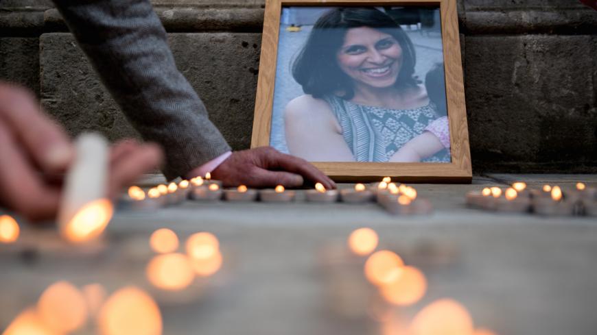 LONDON, ENGLAND - JUNE 11:  A photo of Nazanin Zaghari-Ratcliffe is seen amongst candles during a fourth birthday vigil for her daughter Gabriella opposite the Foreign & Commonwealth Office, King Charles Street, London, SW1A on June 11, 2018 in London, England. Richard Ratcliffe has not seen his wife Nazanin Zaghari-Ratcliffe, 38, or daughter Gabriella, 4, since March 2016 when they flew to Iran to visit Nazanin's parents. At the airport on their return to London, Nazanin was arrested while Gabriella's pass