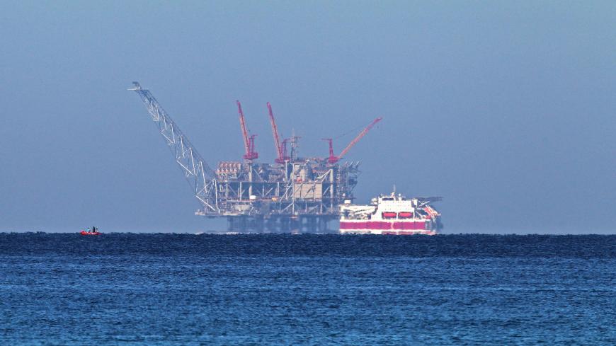 A view of the platform of the Leviathan natural gas field in the Mediterranean Sea is pictured from the Israeli northern coastal city of Caesarea on December 19, 2019. - Israel has approved the export of gas from its offshore reserves to Egypt, a spokeswoman said on December 17, with a major reservoir expected to begin operations imminently.
The approval by Energy Minister Yuval Steinitz was part of a long process under which Israel will transform from an importer of natural gas from Egypt into an exporter 
