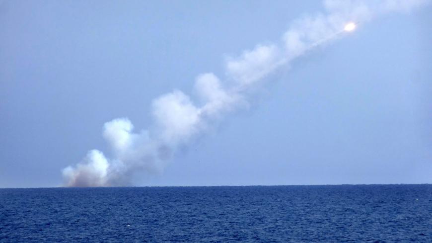 A picture shows a Russian cruise missile launching from a submarine at an undisclosed location in the Mediterranean Sea on September 14, 2017. - The Russian Defence Ministry launched cruise missiles from submarines in the Mediterranean aimed at Islamic State targets in eastern Syria. (Photo by Maria Antonova. / AFP) (Photo by MARIA ANTONOVA./AFP via Getty Images)