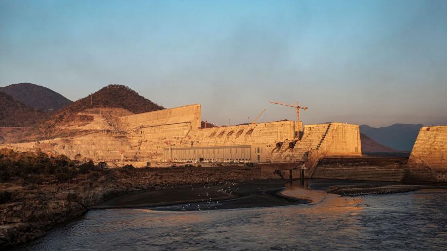 A general view of the the Grand Ethiopian Renaissance Dam (GERD), near Guba in Ethiopia, on December 26, 2019. - The Grand Ethiopian Renaissance Dam, a 145-metre-high, 1.8-kilometre-long concrete colossus is set to become the largest hydropower plant in Africa.
Across Ethiopia, poor farmers and rich businessmen alike eagerly await the more than 6,000 megawatts of electricity officials say it will ultimately provide. 
Yet as thousands of workers toil day and night to finish the project, Ethiopian negotiators