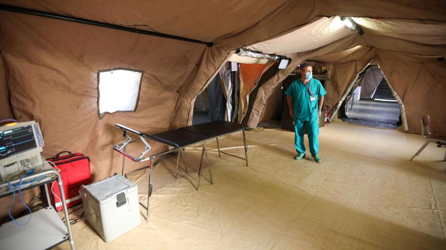 An Italian medic walks around in the coronavirus ward at the Italian field hospital in the Lebanese University campus in the town of Hadath, north of the capital Beirut on September 8, 2020. (Photo by ANWAR AMRO / AFP) (Photo by ANWAR AMRO/AFP via Getty Images)