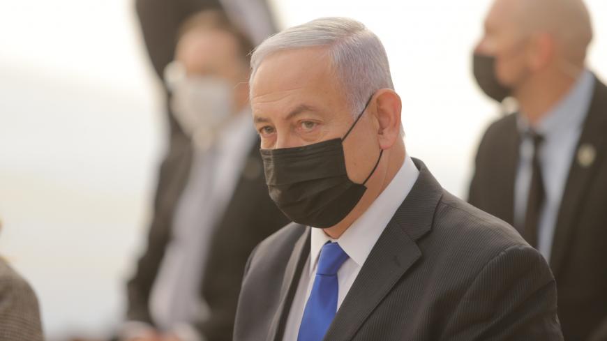 Israeli Prime Minister Benjamin Netanyahu, mask-clad due to the COVID-19 coronavirus pandemic, attends the opening ceremony for Sha'ar Hagay national site, near Jerusalem on November 29, 2020. (Photo by Alex KOLOMIENSKY / POOL / AFP) (Photo by ALEX KOLOMIENSKY/POOL/AFP via Getty Images)