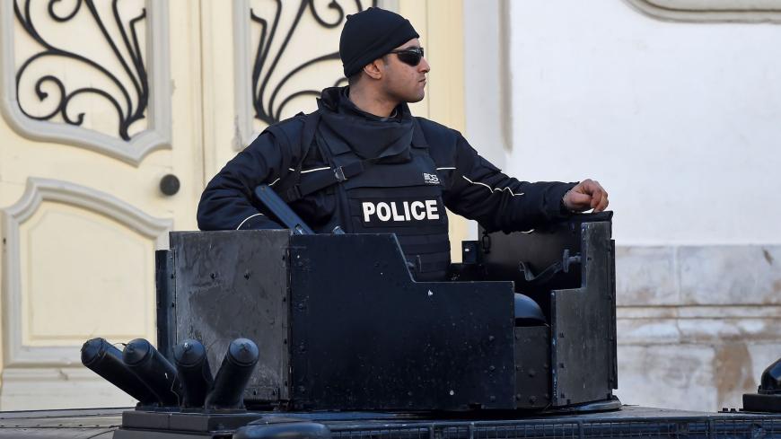 A Tunisian policeman stands guard in central Tunis during a rally marking the ninth anniversary of the 2011 uprising on Habib Bourguiba Avenue on January 14, 2020. (Photo by FETHI BELAID / AFP) (Photo by FETHI BELAID/AFP via Getty Images)