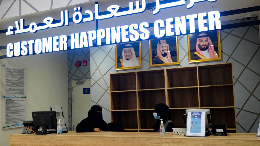 Saudi female employees work at the customers service desk at a hypermarket, newly launched by the operator LuLu and run by a team of women, in the Saudi Arabian port city of Jeddah, on February 21, 2021. (Photo by Amer HILABI / AFP) (Photo by AMER HILABI/AFP via Getty Images)