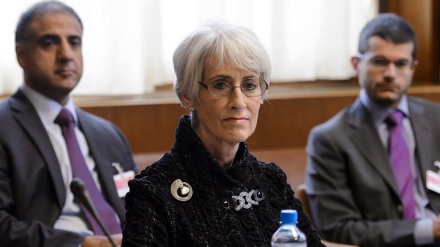 U.S. Under Secretary for Political Affairs Wendy Sherman (C) looks on at the start of two days of closed-door nuclear talks at the United Nations offices in Geneva October 15, 2013. Iran will face pressure on Tuesday to propose scaling back its nuclear programme to win relief from crippling sanctions as talks between world powers and Tehran resume after a six-month hiatus. REUTERS/Fabrice Coffrini/Pool (SWITZERLAND - Tags: POLITICS ENERGY) - RTX14BOC