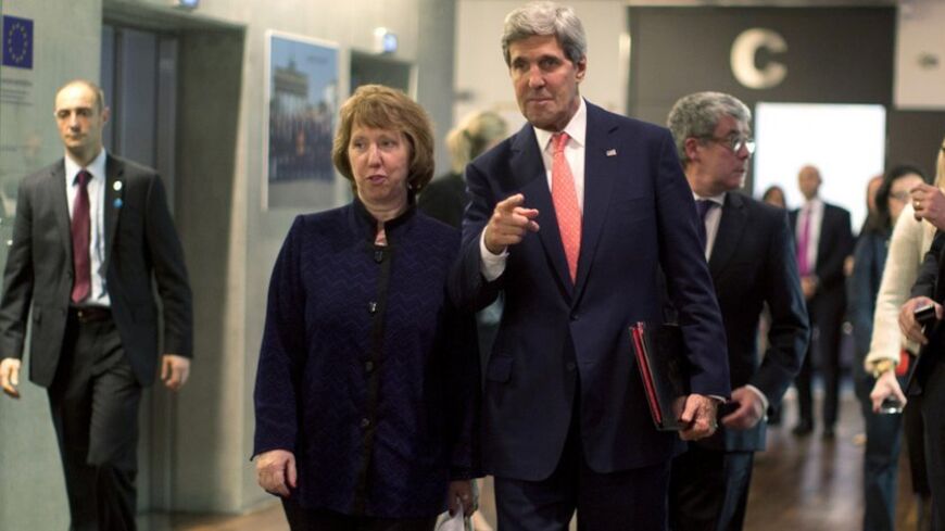 U.S. Secretary of State John Kerry (R) walks with European Union foreign policy chief Catherine Ashton before their meeting with Iranian Foreign Minister Mohammad Javad Zarif (not pictured) in Geneva, November 8, 2013.  REUTERS/Jason Reed   (SWITZERLAND - Tags: POLITICS TPX IMAGES OF THE DAY) - RTX155O8