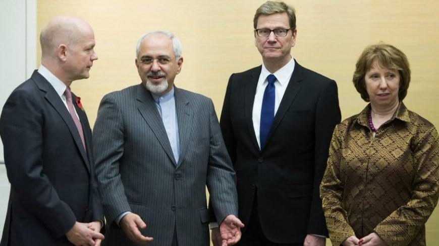 (L-R) British Foreign Secretary William Hague, Iranian Foreign Minister Mohammad Javad Zarif, Germany's Foreign Minister Guido Westerwelle and EU foreign policy chief Catherine Ashton attend the third day of closed-door nuclear talks at the Intercontinental Hotel in Geneva November 9, 2013. France warned of serious stumbling blocks to a long-sought deal on Iran's nuclear programme as foreign ministers from Tehran and six world powers extended high-stakes negotiations into a third day on Saturday to end a de