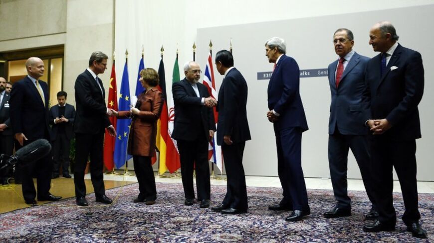 British Foreign Secretary William Hague, Germany's Foreign Minister Guido Westerwelle, European Union foreign policy chief Catherine Ashton, Iranian Foreign Minister Mohammad Javad Zarif, Chinese Foreign Minister Wang Yi, U.S. Secretary of State John Kerry, Russia's Foreign Minister Sergei Lavrov and French Foreign Minister Laurent Fabius (L-R) shake hands after a ceremony at the United Nations in Geneva November 24, 2013. Iran and six world powers reached a breakthrough agreement early on Sunday to curb Te