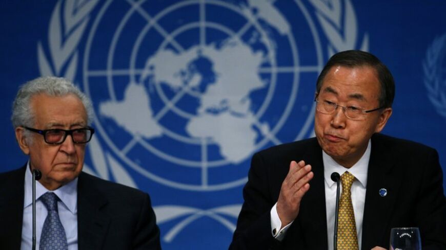 U.N. Secretary-General Ban Ki-moon sits beside U.N.-Arab League envoy for Syria Lakhdar Brahimi (L) as he addresses a news conference after the Geneva-2 peace talks in Montreux January 22, 2014. An international conference on Syria ended on Wednesday, with Ban calling on both Syrian delegations to work sincerely for a solution to the nearly three-year-old conflict. REUTERS/Arnd Wiegmann (SWITZERLAND - Tags: CIVIL UNREST POLITICS CONFLICT) - RTX17Q2W