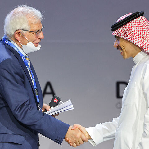 (L to R) EU High Representative for Foreign Affairs and Security Policy Josep Borrell shakes hands with Saudi Arabia's Foreign Minister Prince Faisal bin Farhan al-Saud during a plenary session titled "Transforming for a New Era", during the Doha Forum in Qatar's capital on March 26, 2022. (Photo by KARIM JAAFAR / AFP) (Photo by KARIM JAAFAR/AFP via Getty Images)