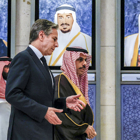 US Secretary of State Antony Blinken (C) speaks with Saudi Arabia's Foreign Minister Prince Faisal bin Farhan (R) as they walk past portraits of the founding leaders of the Gulf Cooperation Council during the Joint Ministerial Meeting of the GCC-US Strategic Partnership discussing the humanitarian situation in Gaza, at the GCC Secretariat in Riyadh on April 29, 2024. (Photo by EVELYN HOCKSTEIN / POOL / AFP) (Photo by EVELYN HOCKSTEIN/POOL/AFP via Getty Images)