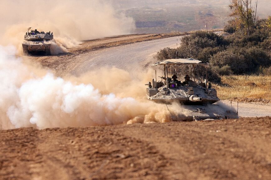 Israeli tanks rolling along the border between Israel and the Gaza Strip on Wednesday
