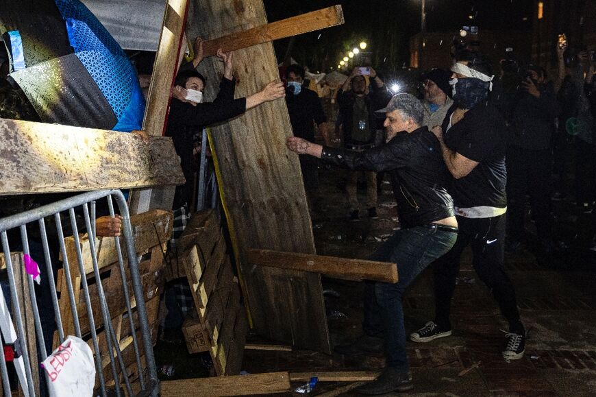 Counter-protesters attacked a pro-Palestinian encampment at UCLA before police dismantled it
