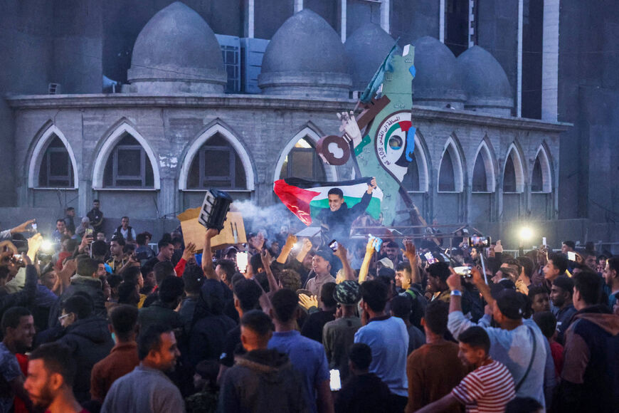 Palestinians celebrate in a street in Rafah, in the southern Gaza Strip, after Hamas announced it has accepted a truce proposal on May 6, 2024, amid the ongoing conflict between Israel and the Palestinian militant group Hamas. Hamas leader Ismail Haniyeh on May 6, informed mediators Qatar and Egypt that his Palestinian militant group had accepted their proposal for a ceasefire in Gaza after nearly seven months of war. (Photo by AFP) (Photo by -/AFP via Getty Images)