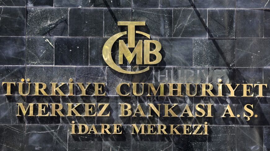 A picture taken on August 14, 2018, shows the logo of Turkey's Central Bank (TCMB) at the entrance of the bank's headquarters in Ankara, Turkey. 