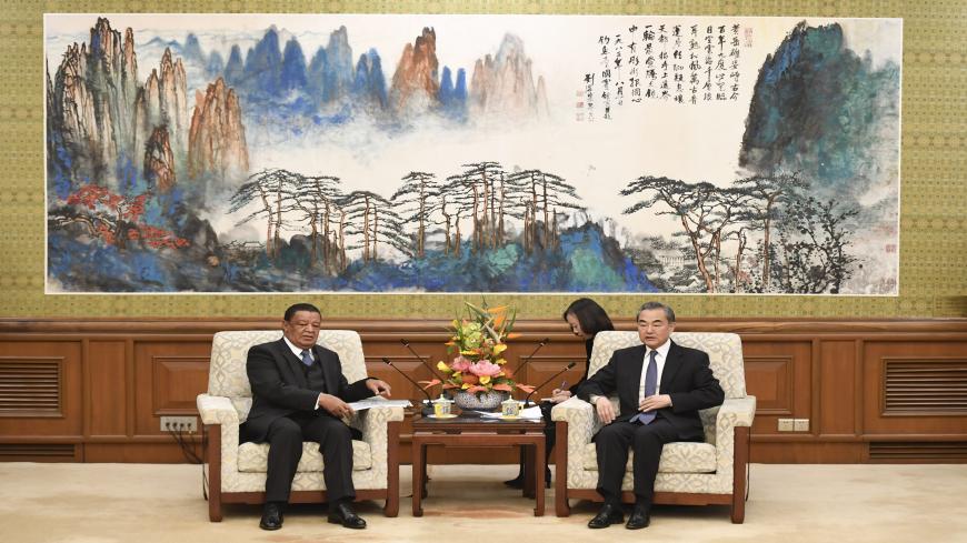 Former Ethiopian President Mulatu Teshome (L) and Chinese State Councilor and Foreign Minister Wang Yi attend a meeting at the Diaoyutai State Guesthouse, Beijing, China, Oct. 30, 2019.