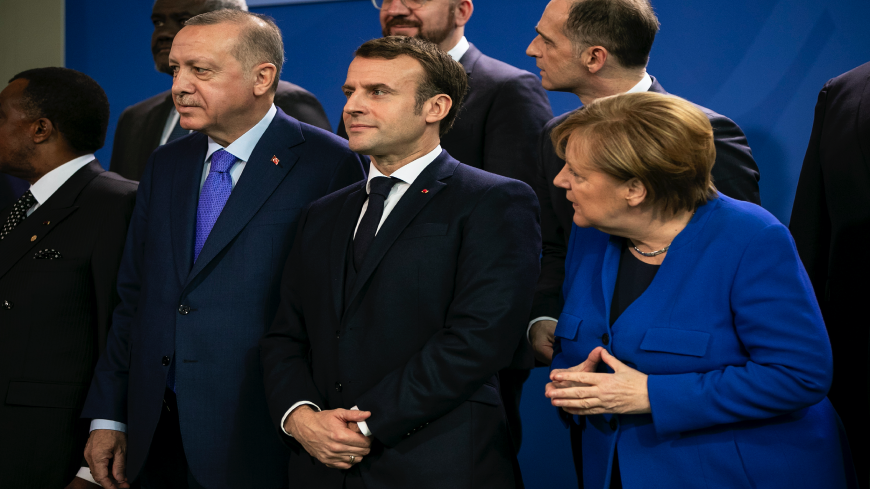 German Chancellor Angela Merkel (R), French President Emmanuel Macron (C) and Turkish President Recep Tayyip Erdogan (L) and other leaders pose for a family picture at the Chancellery on January 19, 2020, in Berlin, Germany. 