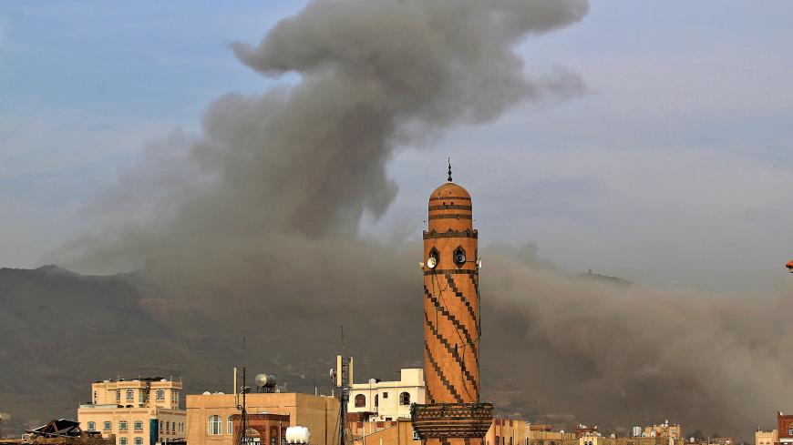 Smoke billows following an airstrike by Saudi-led coalition in the Yemeni capital Sanaa, on June 16, 2020. 