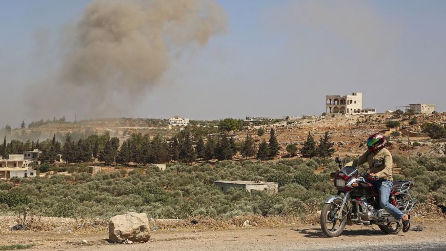 Smoke billows following a reported Russian airstrike on the western countryside of the mostly rebel-held Syrian province of Idlib, on Sept. 20, 2020.