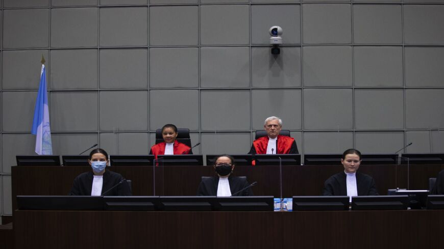 Judges David Re (up, R) and Janet Nosworthy (up, L) are seen before the start of the session of the Lebanon Tribunal in Leidschendam, on Dec. 11, 2020, where the sentence was set for Salim Jamil Ayyash, a member of the Hezbollah militant group who was convicted of involvement in the assassination of former Lebanese Prime Minister Rafik Hariri and 21 others 15 years ago. Ayyash, 57, was found guilty in absentia of murder and terrorism on Aug. 18 by the Netherlands-based Special Tribunal for Lebanon over the 