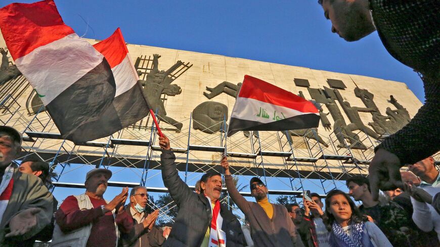 Iraqi protesters take part in a demonstration at Tahrir Square in Baghdad on December 21, 2020.