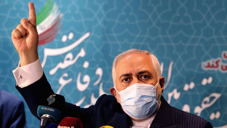 Iranian Foreign Minister Mohammad Javad Zarif speaks during a press conference at the International Conference on the Legal-International Claims of the Holy Defense in the capital Tehran on Feb. 23, 2021.