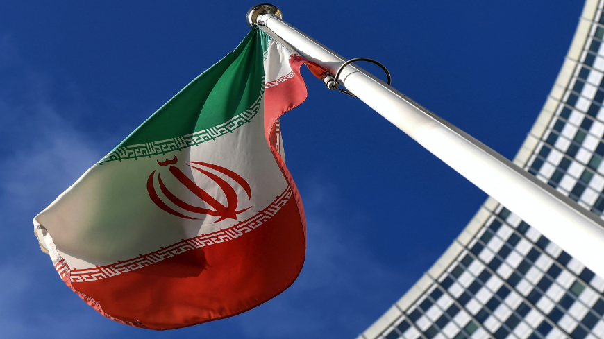 The Iranian national flag is seen outside the International Atomic Energy Agency (IAEA) headquarters during the agency's Board of Governors meeting in Vienna on March 1, 2021. (Photo by JOE KLAMAR / AFP) 