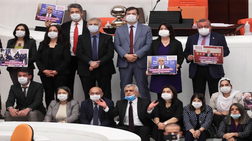 Omer Faruk Gergerlioglu (C, front row with a blue mask), a human rights advocate and lawmaker from the Peoples' Democratic Party (HDP) and his colleagues pose after the parliament stripped his parliamentary seat, Ankara, Turkey, March 17, 2021.