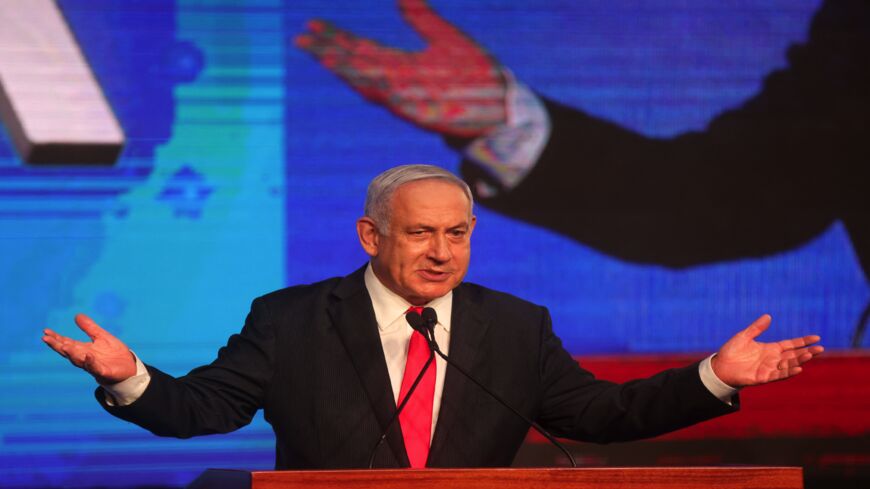 Israeli Prime Minister Benjamin Netanyahu, leader of the Likud party, addresses supporters at the party campaign headquarters in Jerusalem early on March 24, 2021, after the end of voting in the fourth national election in two years.