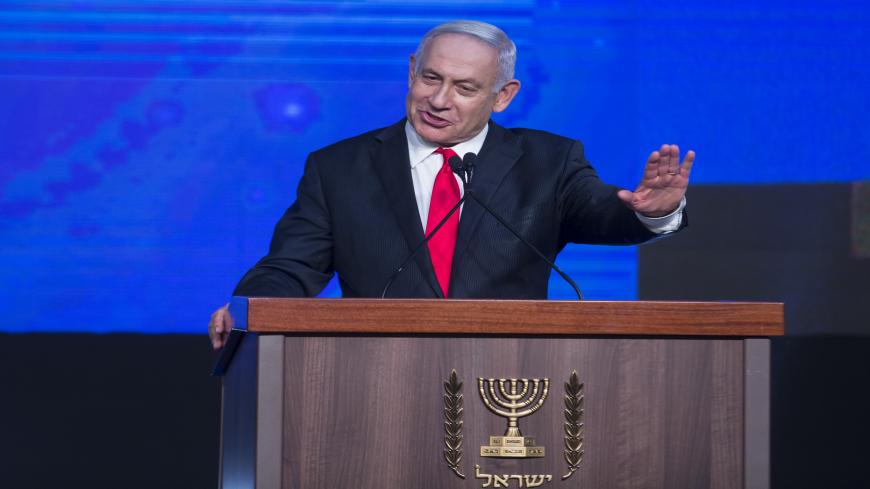 Israeli Prime Minster Benjamin Netanyahu greets supporters as he speaks at the Likud party vote event, Jerusalem, March 24, 2021.